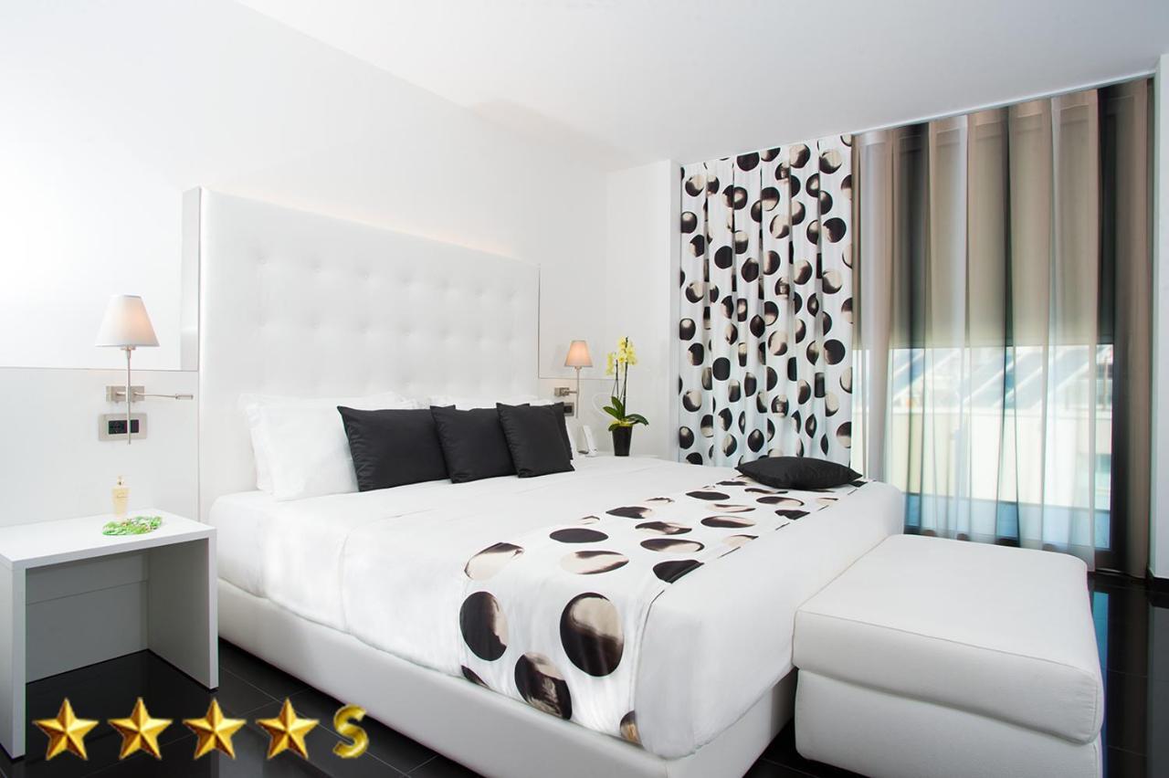 Hotel Rossini 4S Lignano Sabbiadoro Bagian luar foto