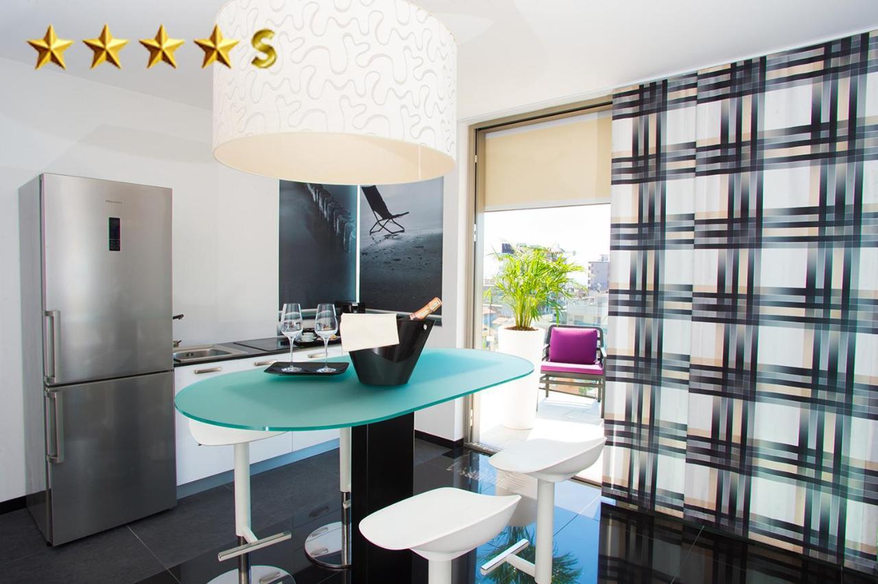 Hotel Rossini 4S Lignano Sabbiadoro Bagian luar foto