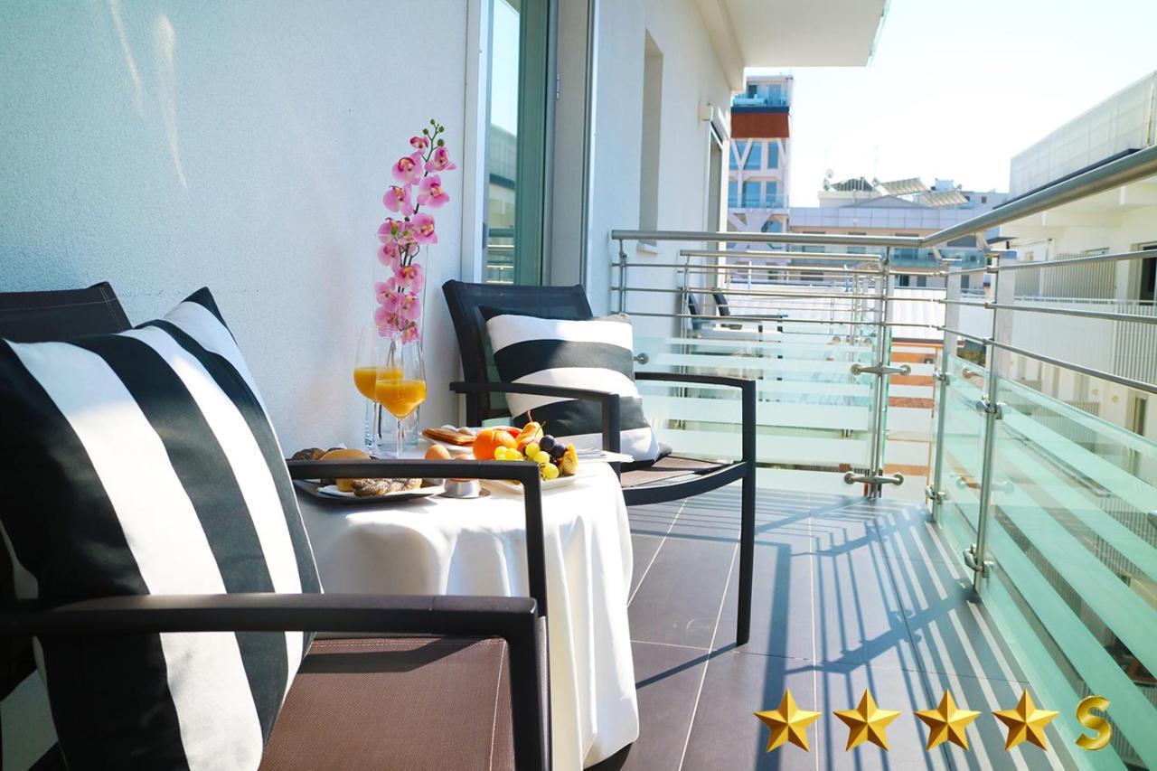 Hotel Rossini 4S Lignano Sabbiadoro Bagian luar foto